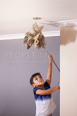 Buy stock photo Child, dusting and ceiling in house for spring cleaning, learning responsibility and development. Young boy, kid or children and reaching light for busy routine, childhood and cute in dusty home
