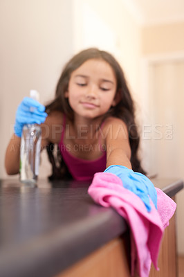 Buy stock photo Young girl, cloth and spring cleaning in kitchen for learning, housework and child development in apartment. Kid, counter and wipe table indoors for hygiene, responsibility and help in family home