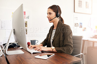 Buy stock photo Cropped shot of a young businesswoman working in her office
