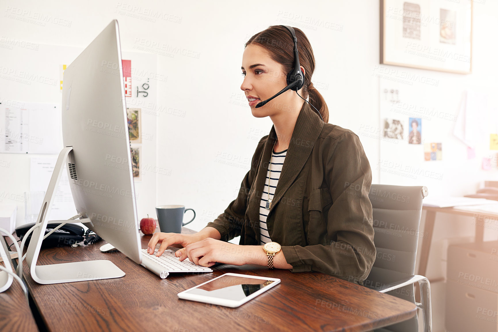 Buy stock photo Cropped shot of a young businesswoman working in her office