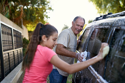 Buy stock photo Father, child and car washing for cleaning, learning responsibility and development outdoor. Young girl, kid or teenager and dad for busy routine, childhood and cute for soapy water or fun on weekend