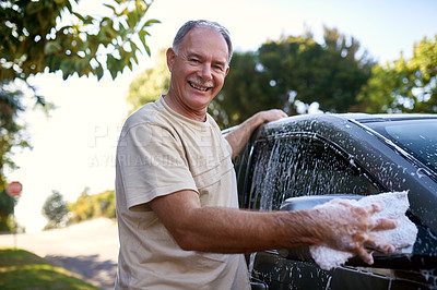 Buy stock photo Portrait of a man washing a car outside