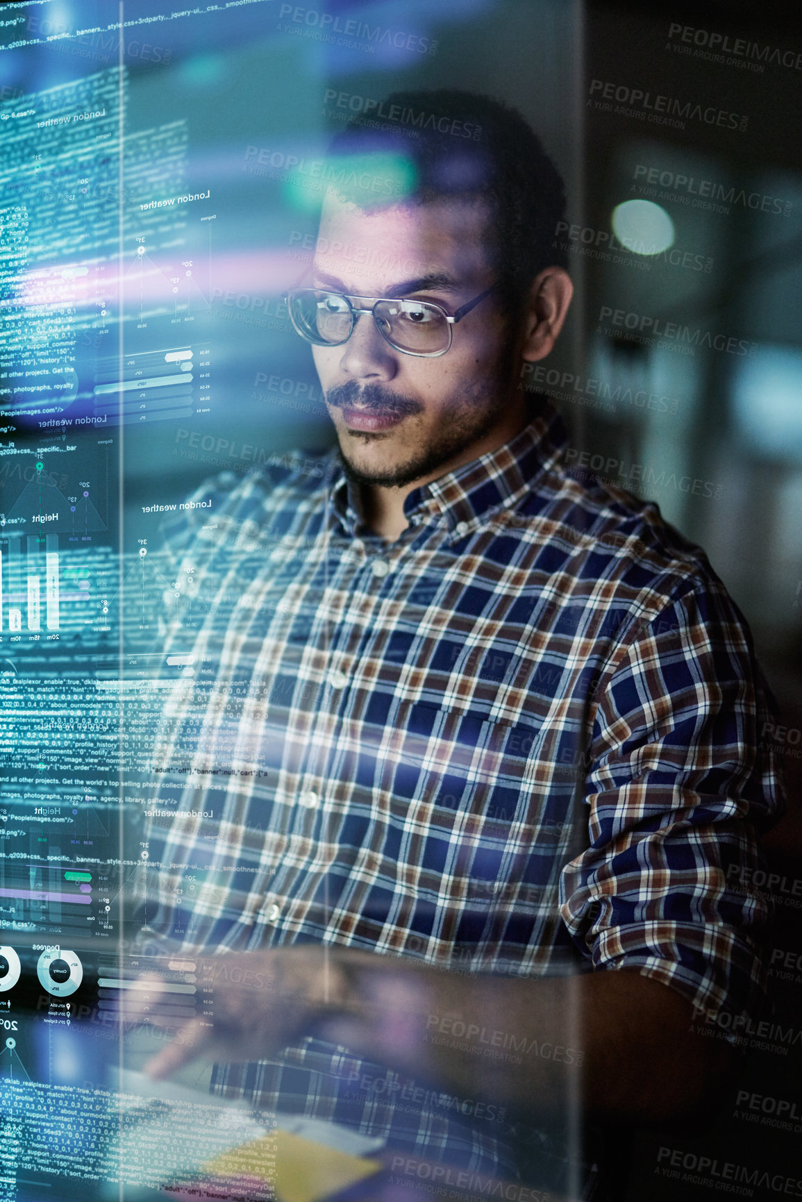 Buy stock photo Cropped shot of a young computer programmer looking through data