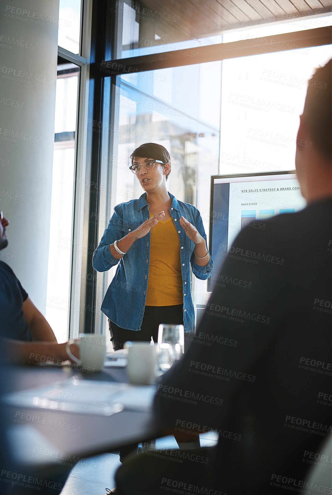 Buy stock photo Cropped shot of a young businesswoman giving a presentation in the boardroom