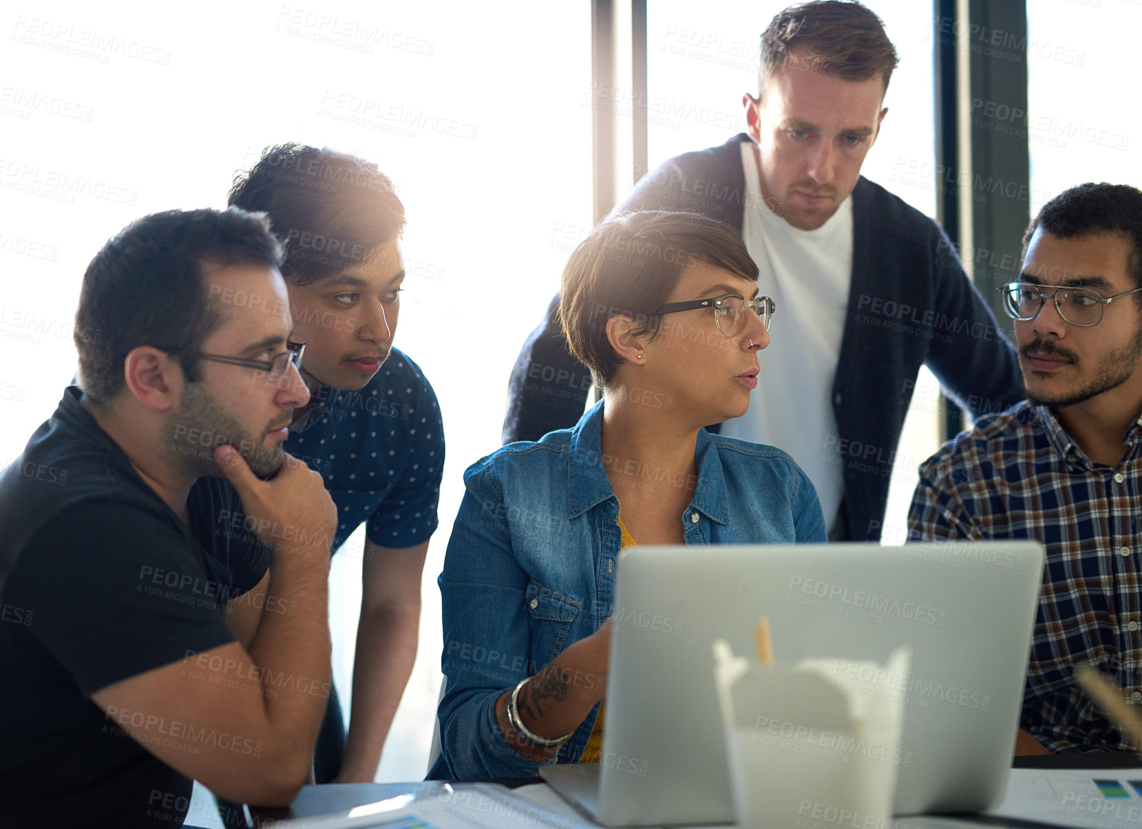 Buy stock photo Shot of a group of colleagues having a meeting in the boardroom 