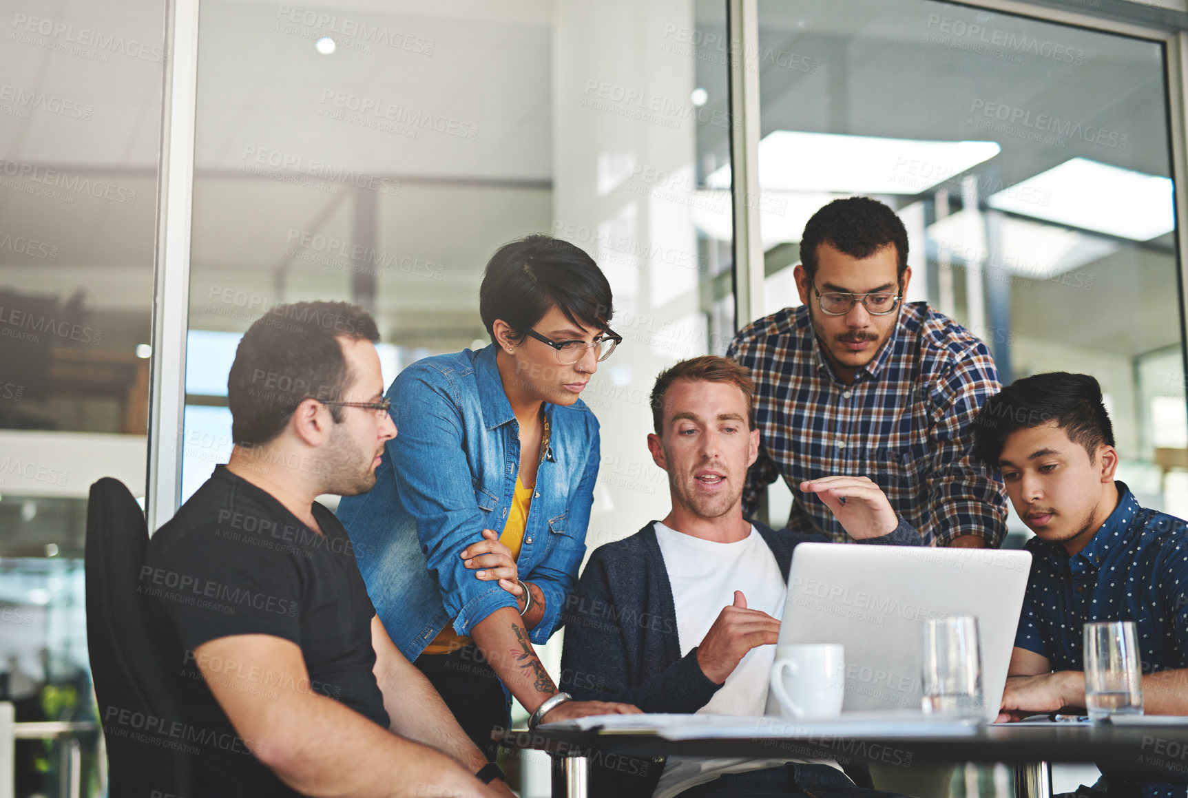 Buy stock photo Shot of a group of colleagues having a meeting in the boardroom 