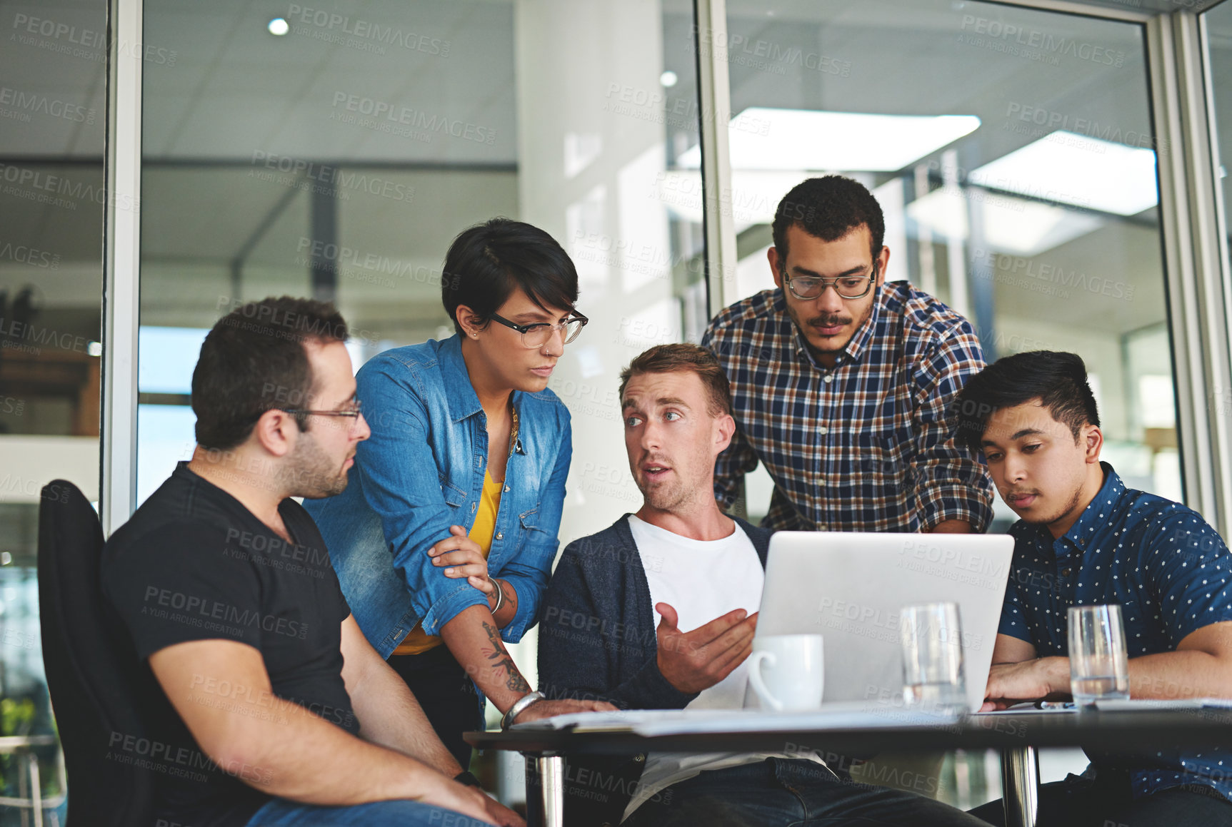 Buy stock photo Shot of a group of colleagues having a meeting in the boardroom 