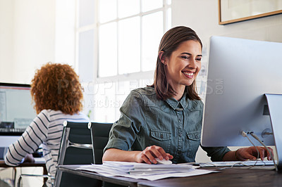 Buy stock photo Shot of colleagues working on their computers in an open plan office