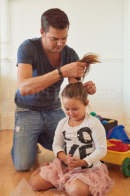 Buy stock photo Tie, home or father with child for hair, support or help to get ready for school or kindergarten. Girl ponytail, prepare or dad with daughter on floor of family house for playing or bonding together