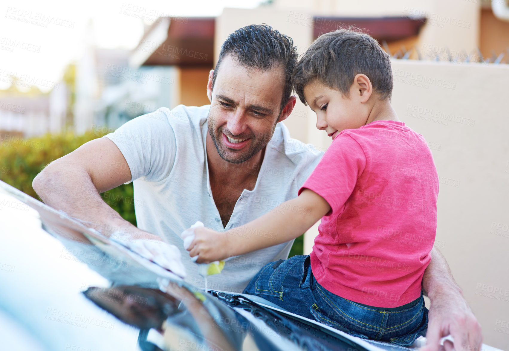 Buy stock photo Chores, washing car and father with son in driveway of home in summer together for child development. Family, love or smile with happy parent and boy kid cleaning vehicle outdoor for responsibility