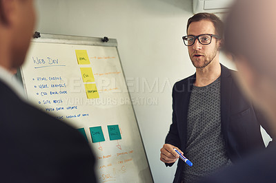 Buy stock photo Web design, manager with team, man and a whiteboard planning in a business meeting in modern office or startup together. Teamwork or collaboration, developer group or ideas and colleagues in workshop