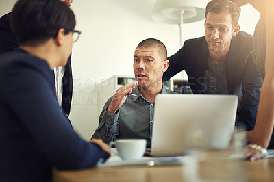 Buy stock photo Shot of a group of coworkers having a discussion in a boardroom
