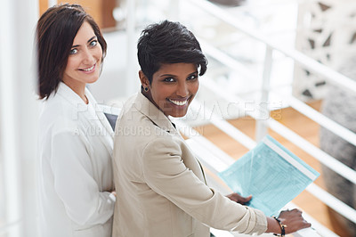 Buy stock photo Portrait of two businesswomen standing in an office