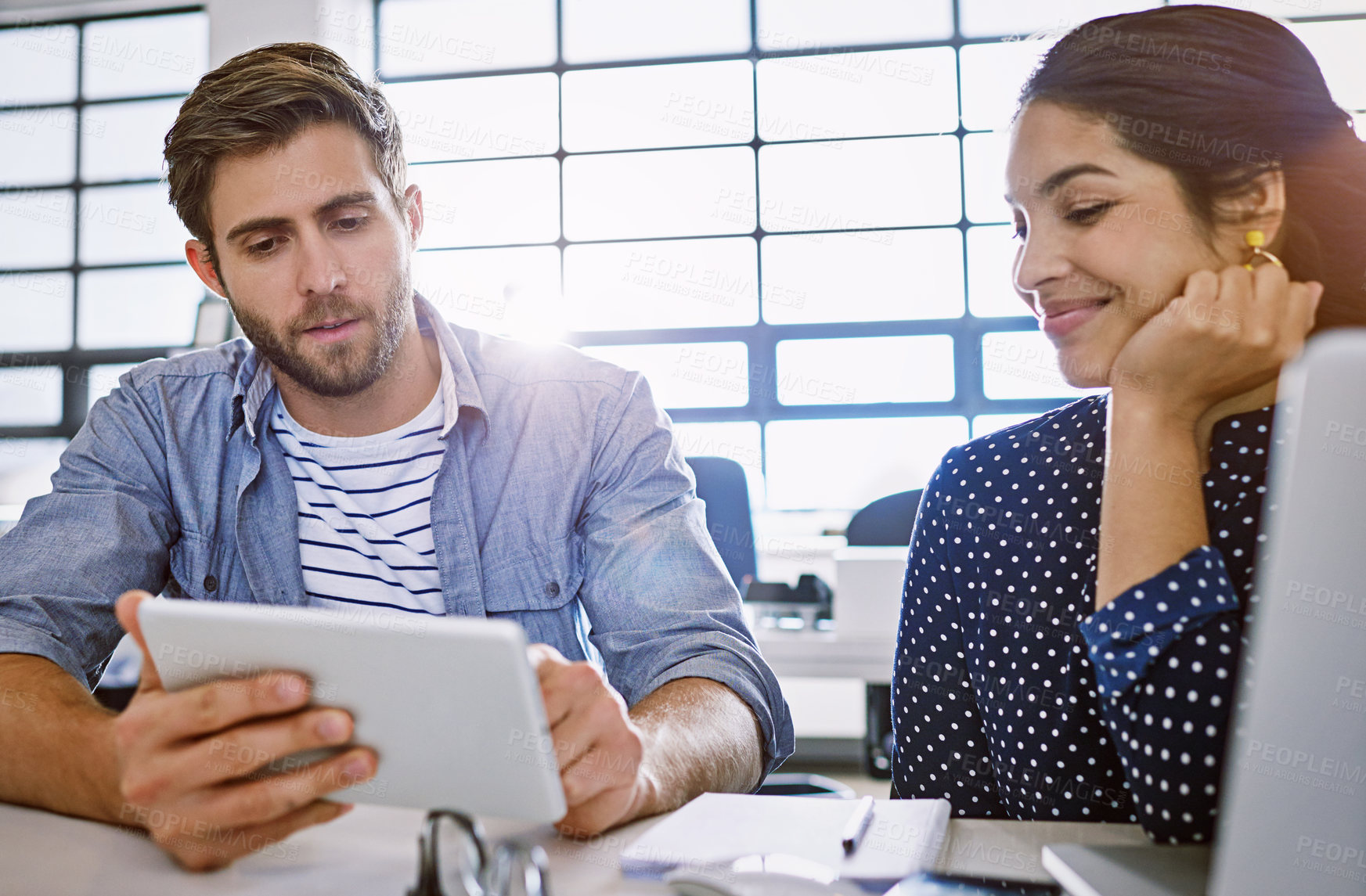 Buy stock photo Conversation, tablet and opinion, man and woman in office sharing ideas and meeting for creative project. Teamwork, planning proposal and employees in discussion at tech startup or design agency.