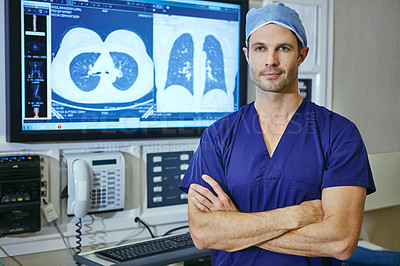 Buy stock photo Portrait of a male surgeon standing with his arms crossed with a medical scan in the background