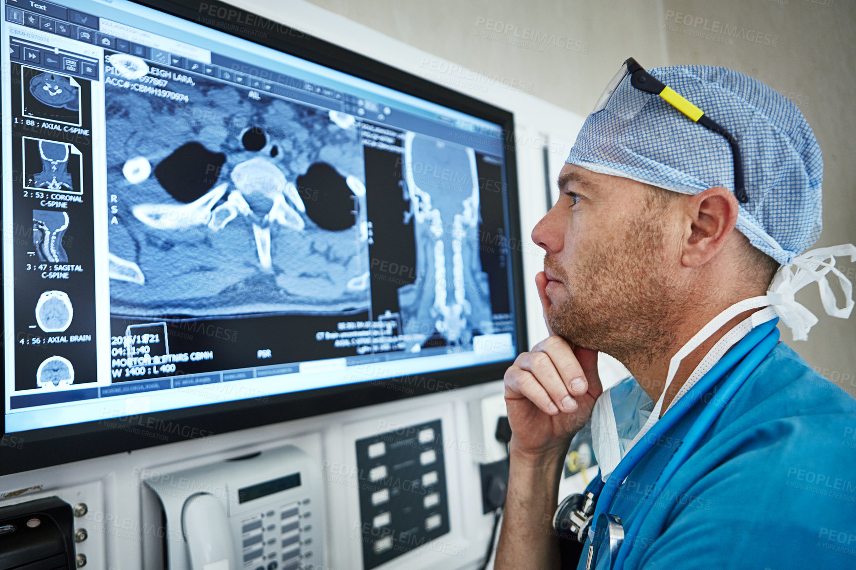 Buy stock photo Shot of a surgeon looking at a patient's medical scan