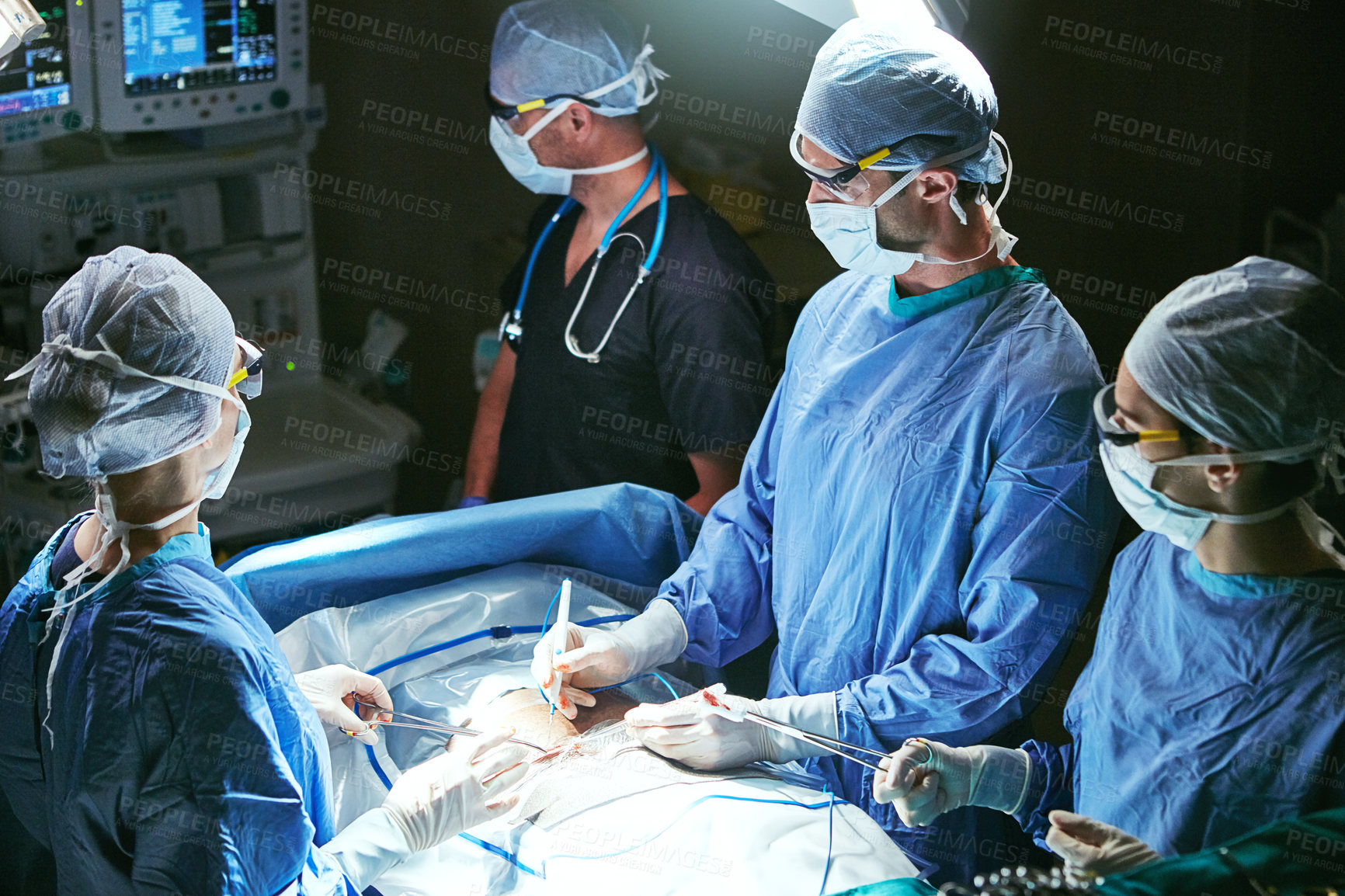 Buy stock photo Cropped shot of surgeons in an operating room