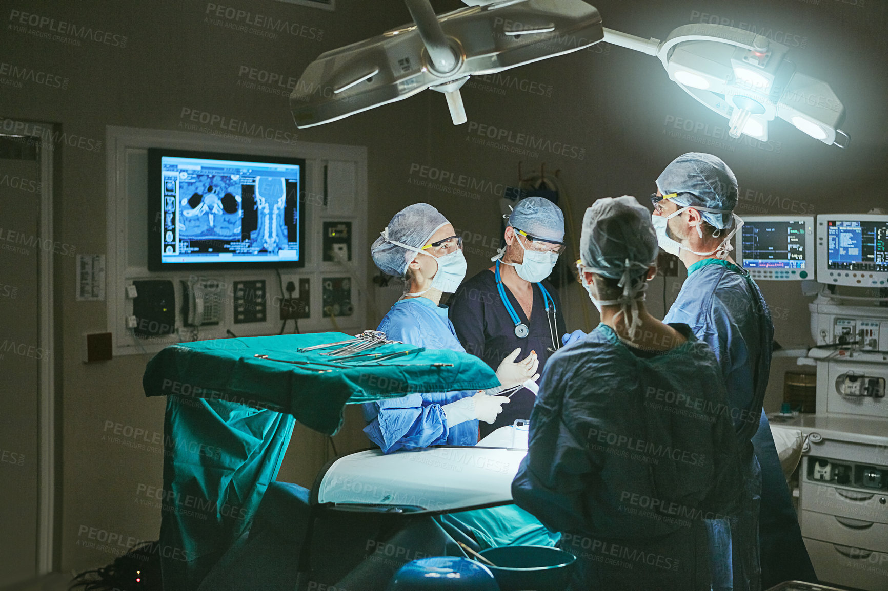 Buy stock photo Cropped shot of surgeons in an operating room