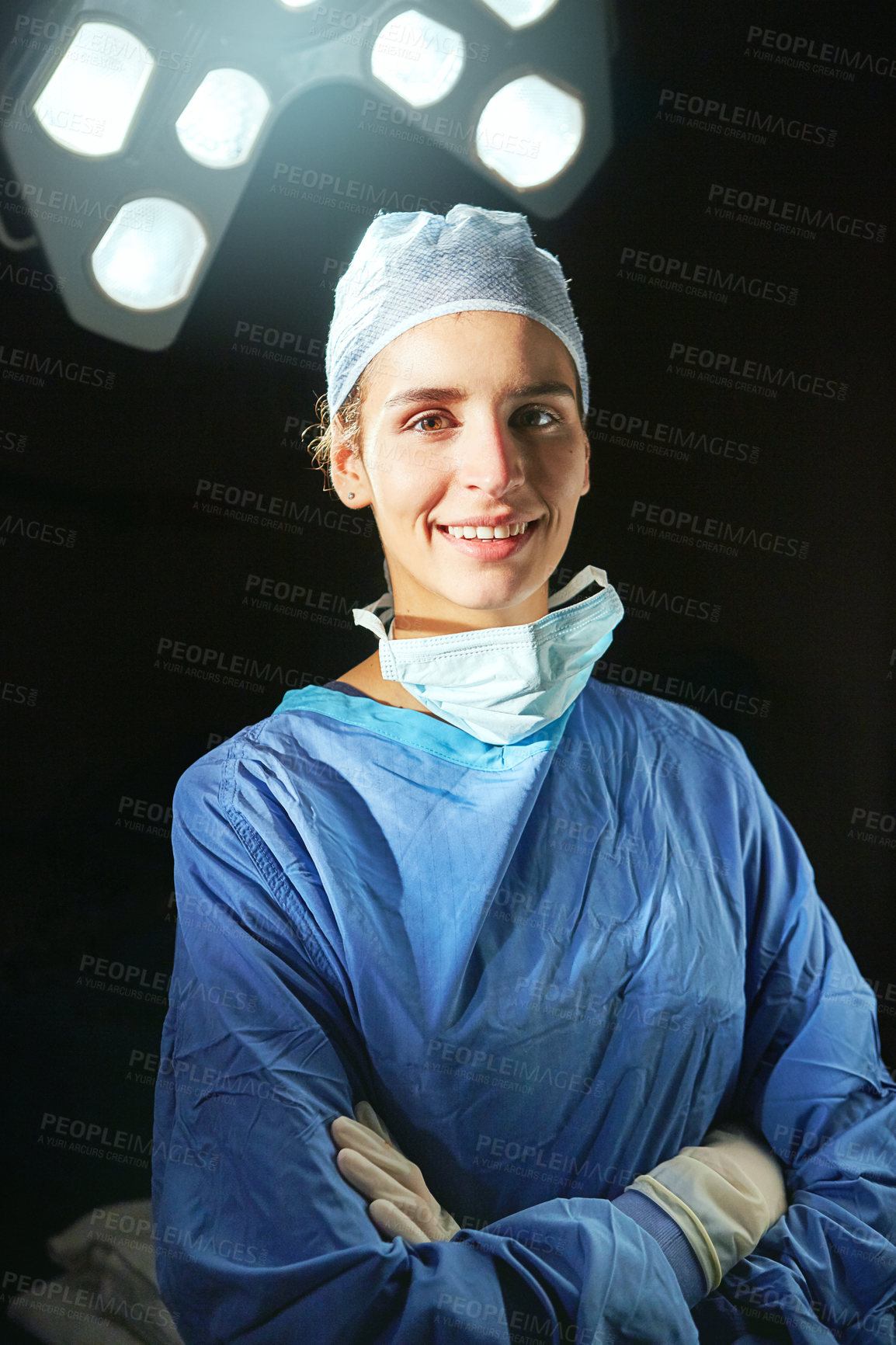 Buy stock photo Cropped portrait of a female doctor against a dark background