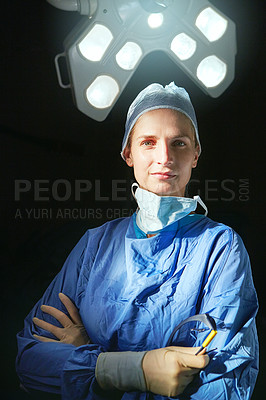 Buy stock photo Cropped portrait of a female doctor against a dark background