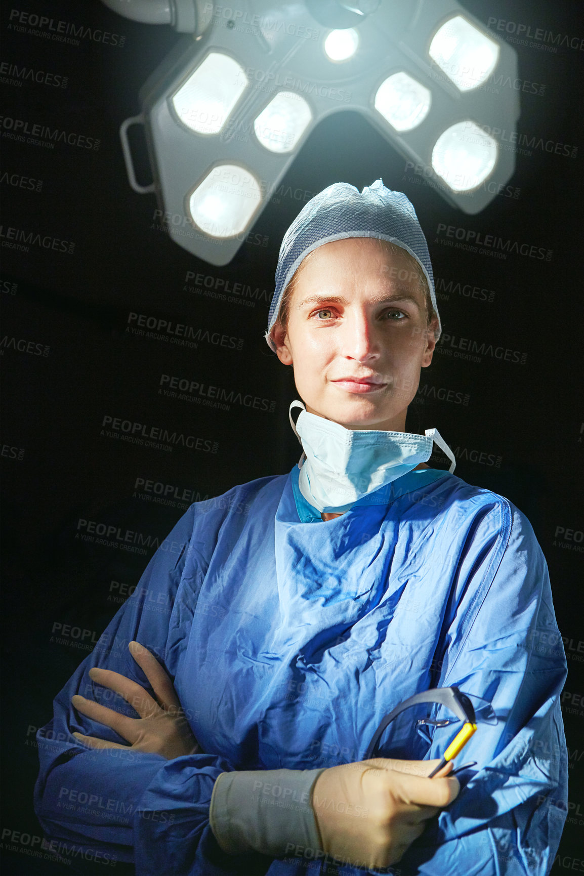 Buy stock photo Cropped portrait of a female doctor against a dark background