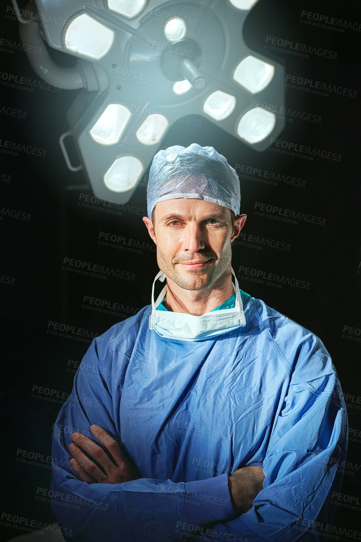 Buy stock photo Cropped portrait of a male doctor against a dark background