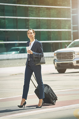 Buy stock photo Shot of a young businesswoman on the move in the city