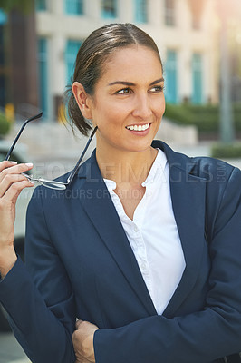 Buy stock photo Shot of a modern businesswoman in the city