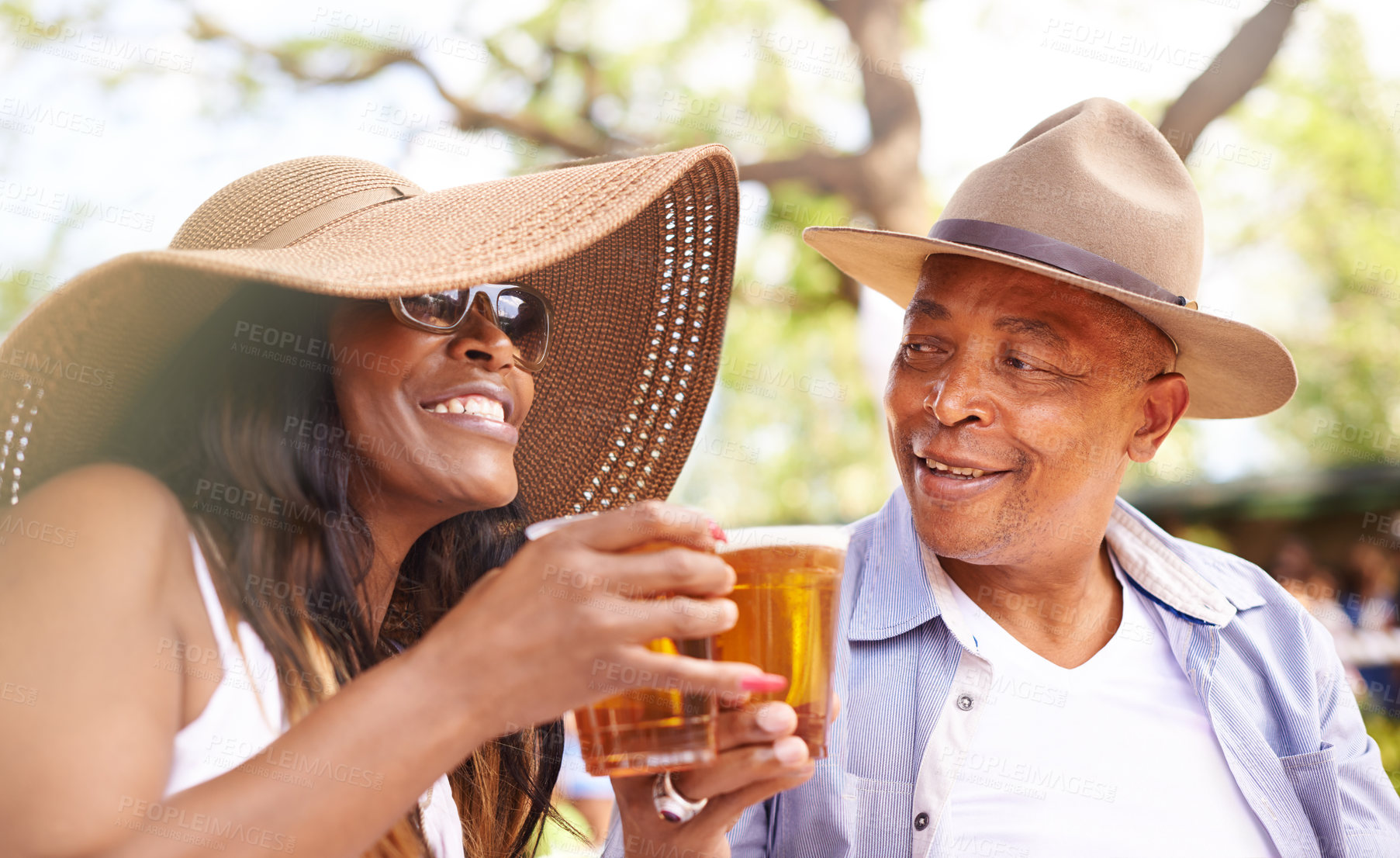 Buy stock photo Cropped shot of a mature couple talking in their frontyard