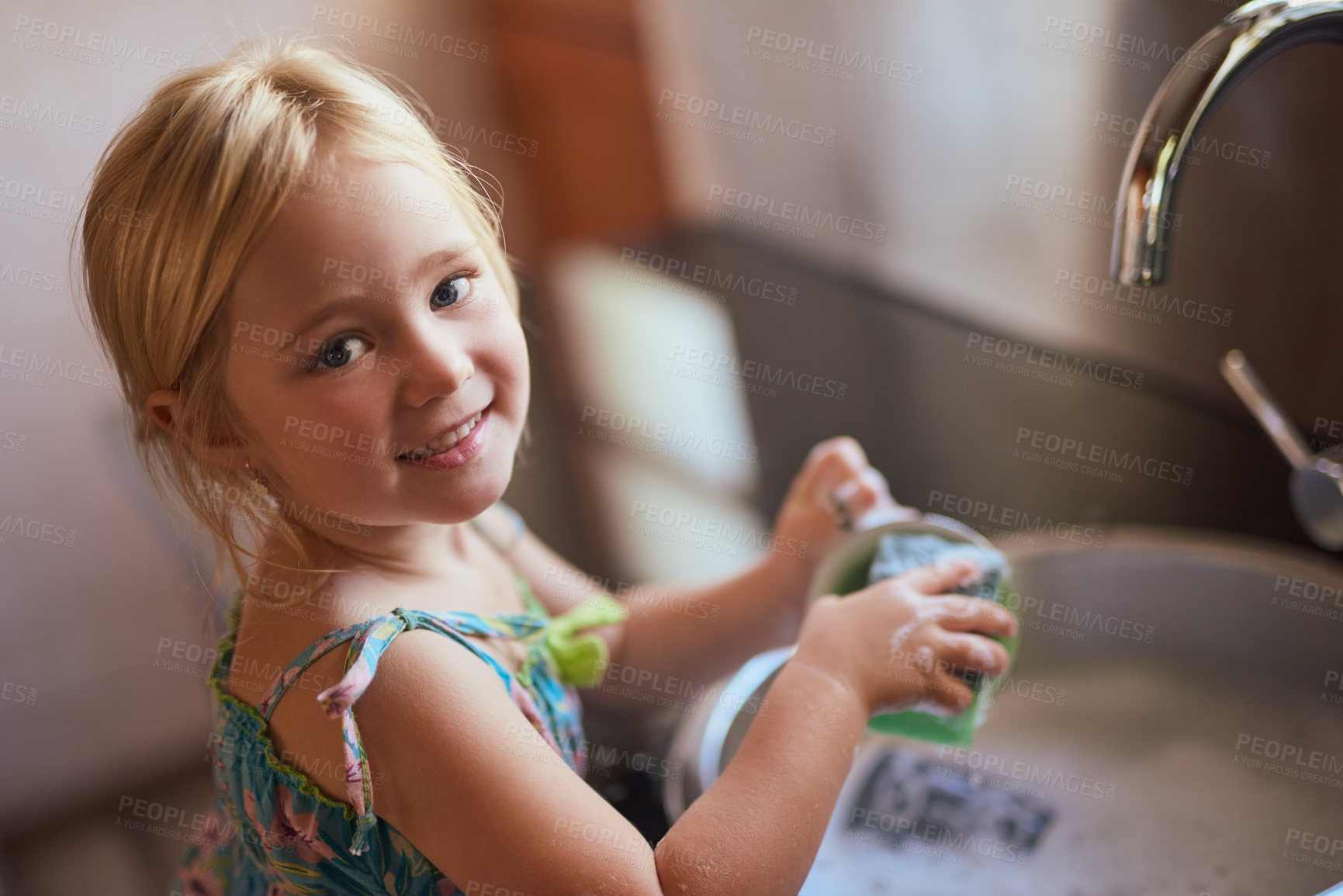 Buy stock photo Kitchen, portrait and girl child washing dishes with smile, learning or help at basin in home. Housework, growth and kid cleaning at sink with development, pride and happy morning housekeeping chores