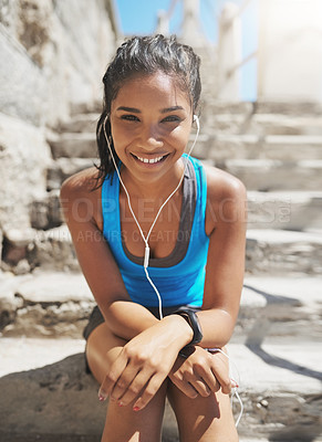 Buy stock photo Portrait of a young sporty woman with earphones on