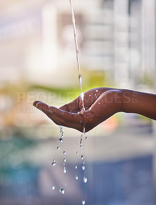 Buy stock photo Cropped shot of a man washing his hands with refreshing water outdoors
