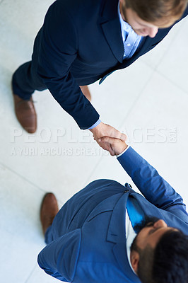 Buy stock photo Shot of two businessmen shaking hands