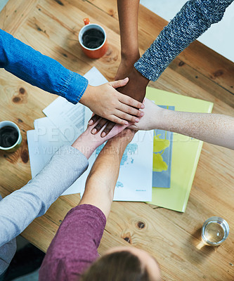 Buy stock photo Creative people, hands together and teamwork with diversity, documents or unity for project above at office. Top view of diverse group piling for community agreement, meeting or startup at workplace