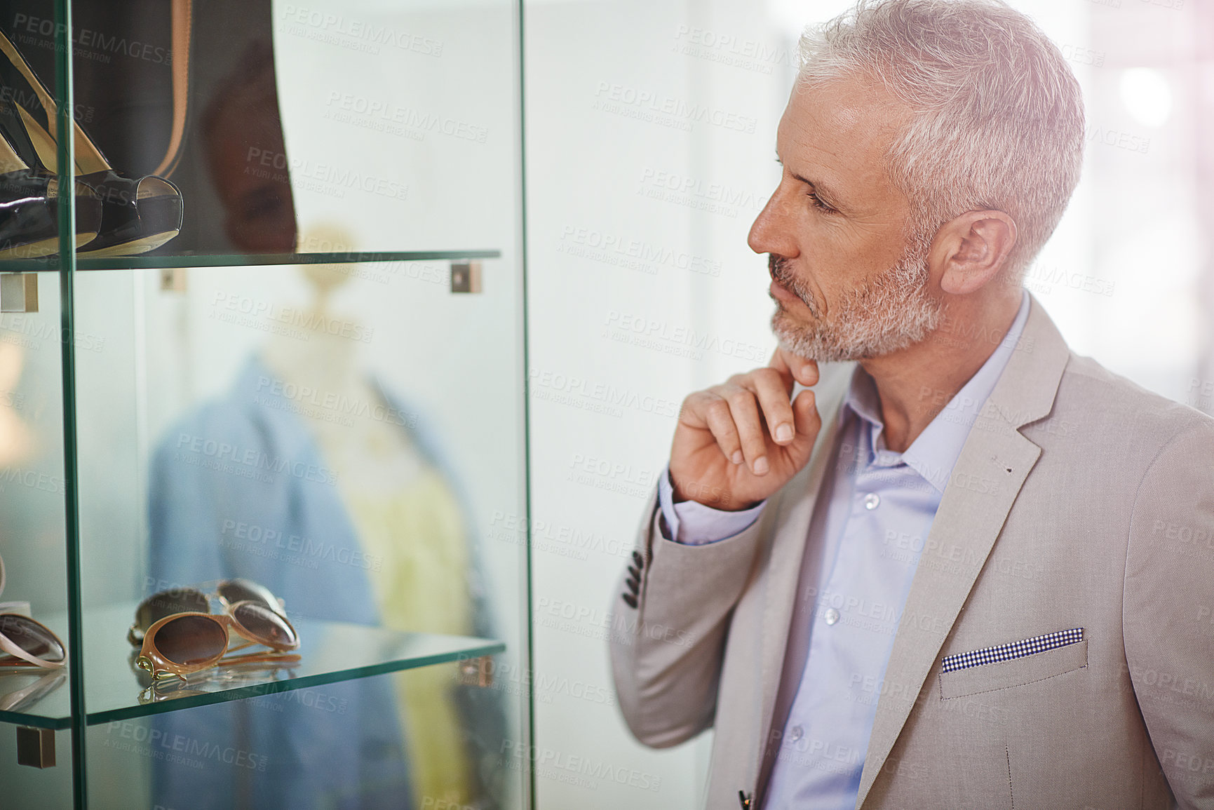 Buy stock photo Shot of a mature man window shopping in a mall