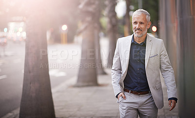 Buy stock photo Shot of a mature businessman standing outside