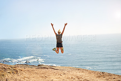 Buy stock photo Shot of a young woman jumping for joy after her workout