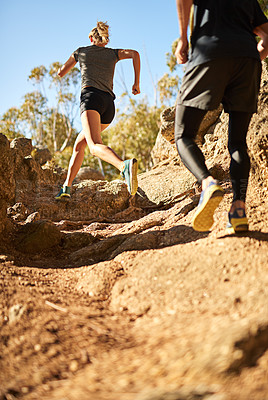 Buy stock photo Shot of a young couple out for a trail run