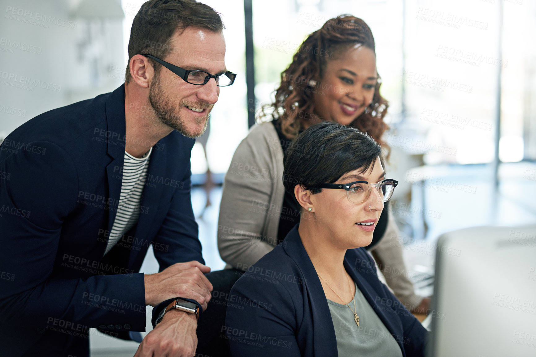 Buy stock photo Cropped shot of three colleagues working in the office