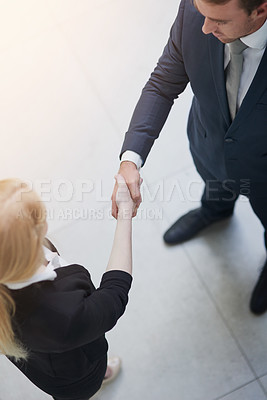 Buy stock photo Top view, business people and handshake for deal, success or b2b agreement of agent in corporate office. Above, shaking hands and meeting for introduction, welcome and thank you for collaboration