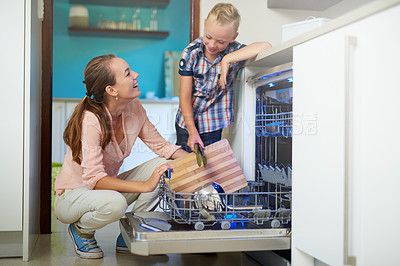 Buy stock photo Happy, mother and kid in kitchen cleaning for education, development and family teamwork. Smiling, parent and child working together for teaching, hygiene or learning healthy habits and bonding