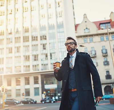 Buy stock photo Shot of a young businessman on the move in the city