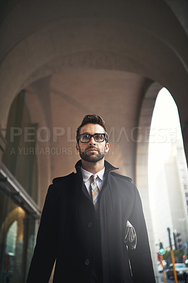 Buy stock photo Shot of a stylish young man on the move in the city