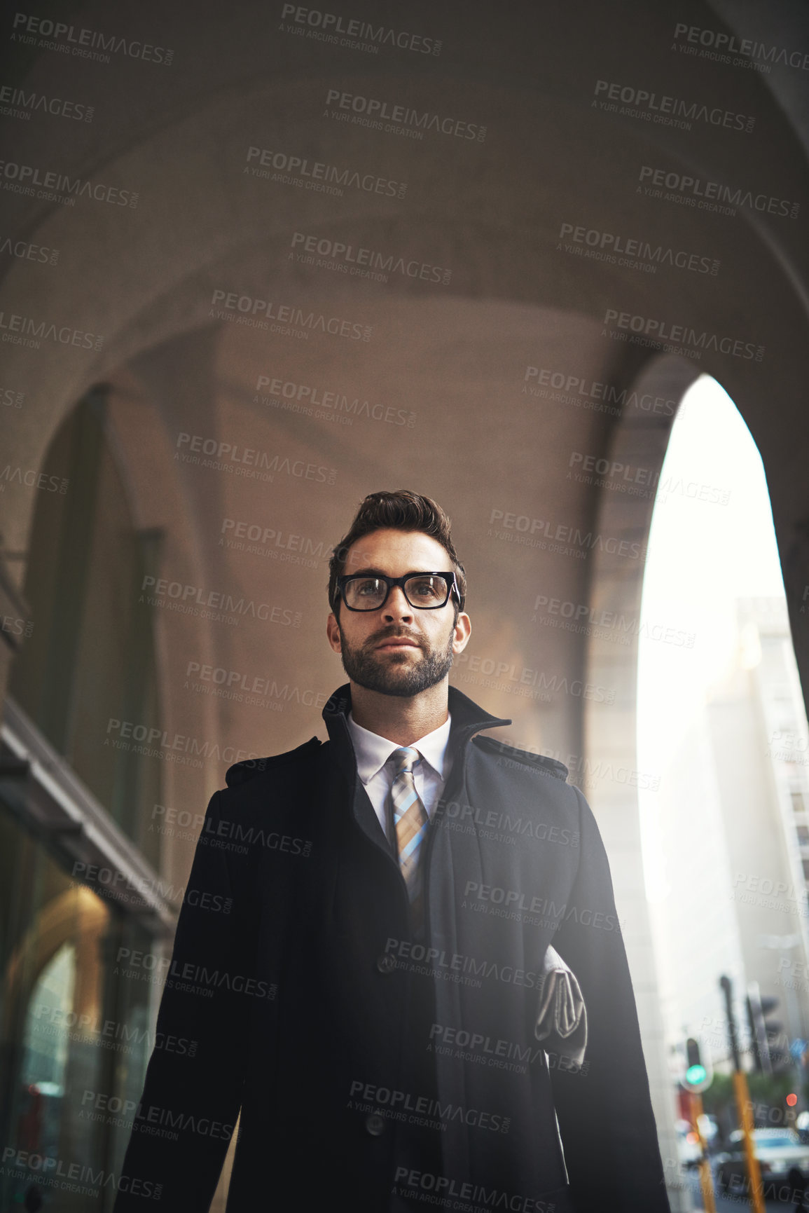 Buy stock photo Fashion, glasses and man by building in city with stylish, trendy and winter coat outfit. Serious, walking and male lawyer with elegant jacket and spectacles for corporate legal career in town.