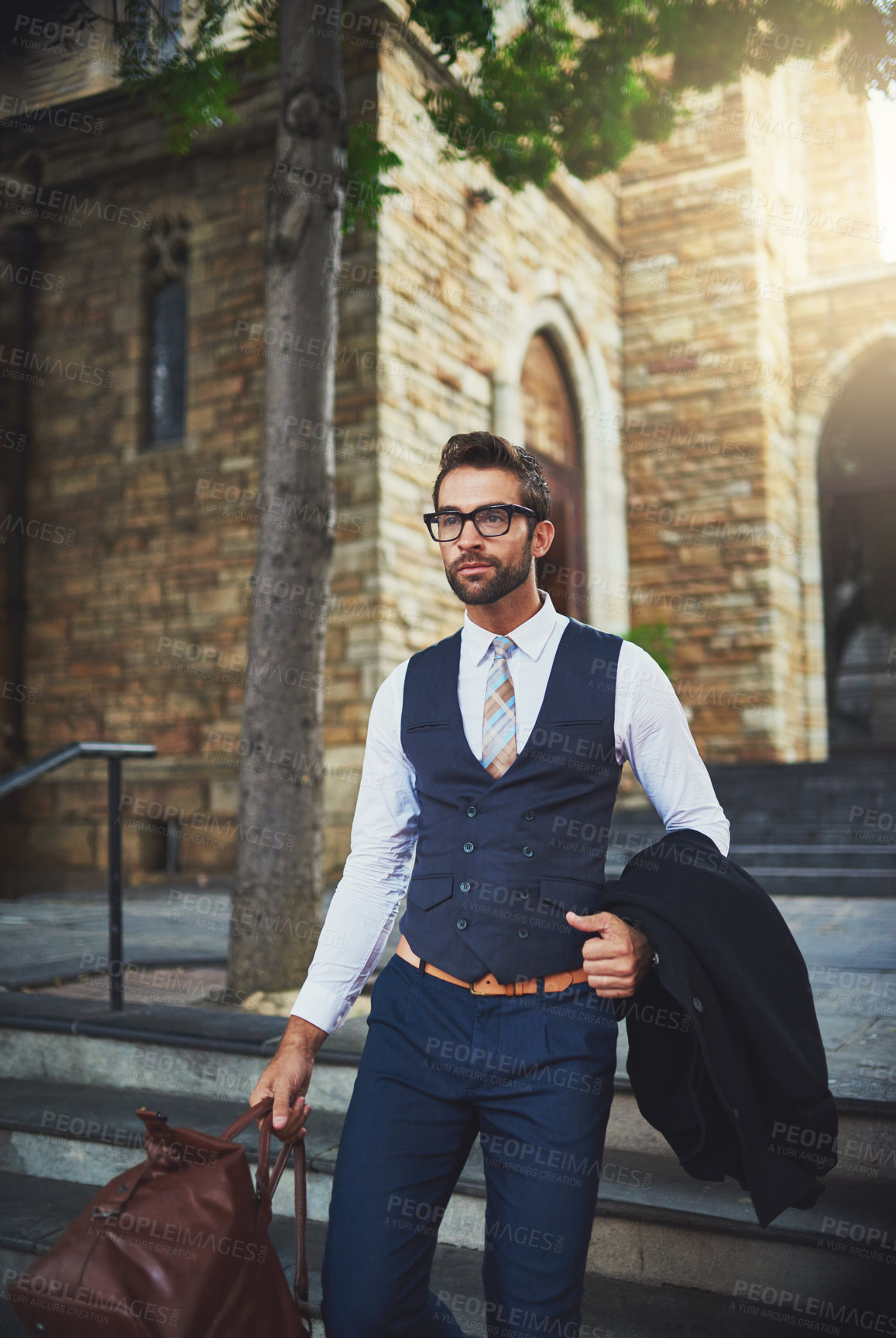 Buy stock photo Fashion, walking and businessman with luggage in city with coat, glasses and classy outfit for legal career. Travel, spectacles and male law advocate commuting in town with baggage in New York.