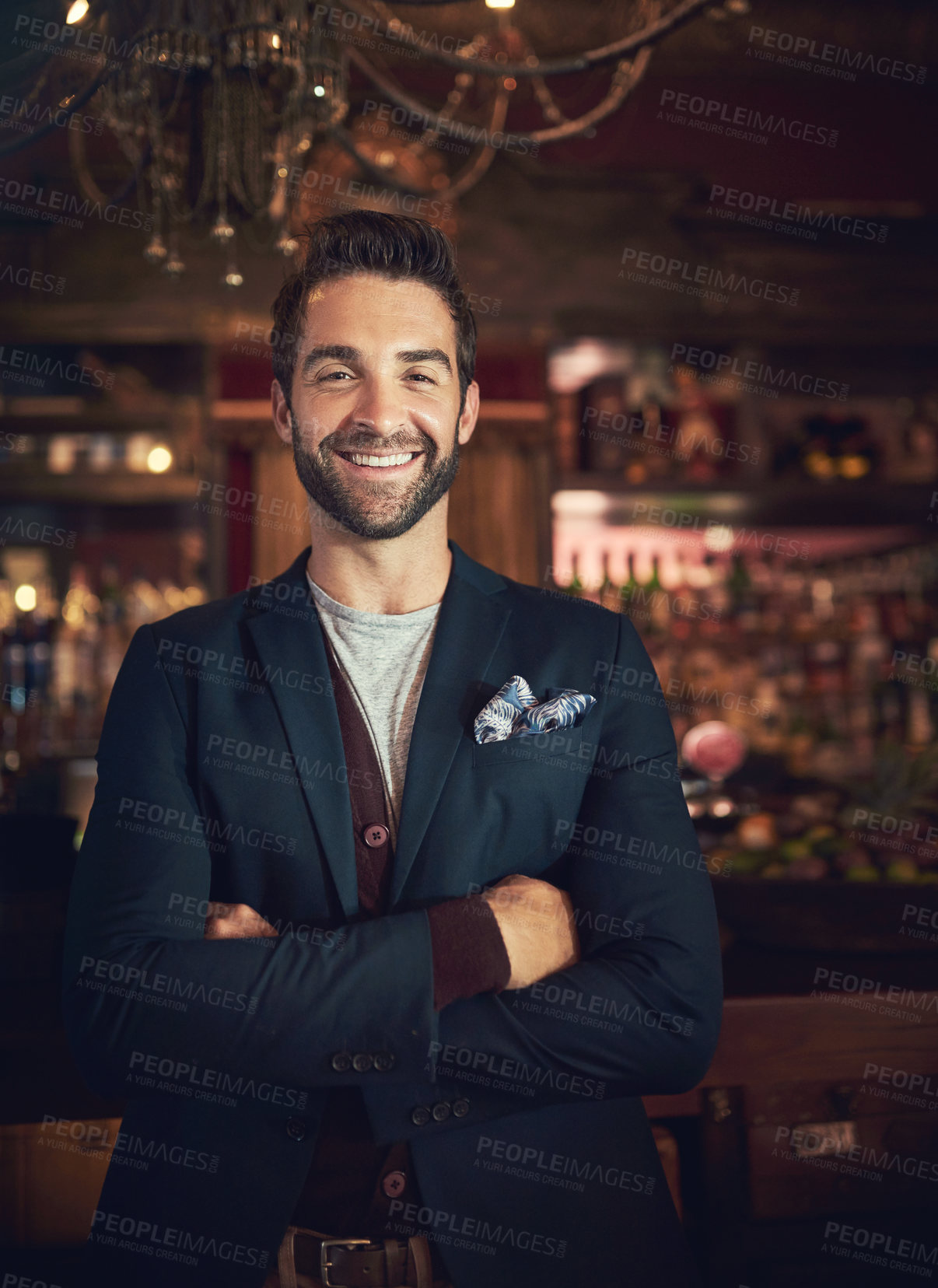 Buy stock photo Cropped portrait of a young man standing in a bar