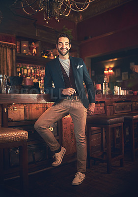 Buy stock photo Full length portrait of a young man standing in a bar