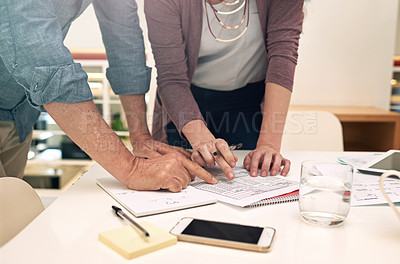 Buy stock photo Cropped shot of a two colleagues having a meeting in a modern office