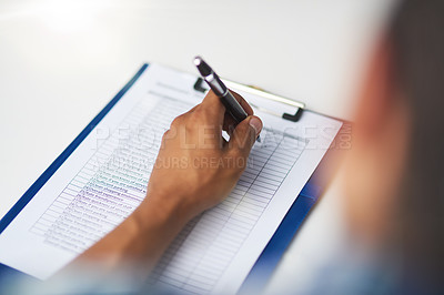 Buy stock photo Shot of a person filling in a form