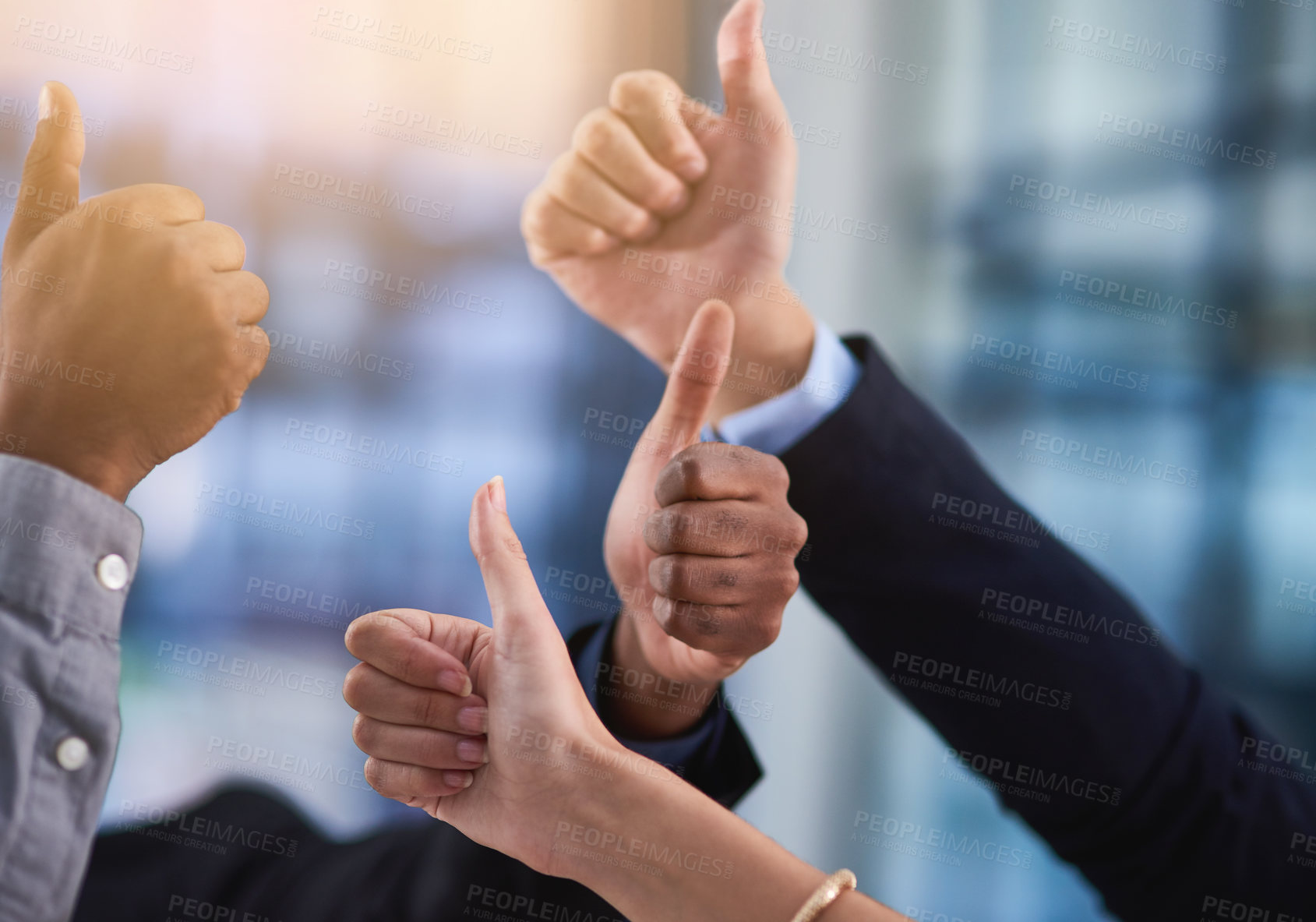 Buy stock photo Cropped shot of a group of businesspeople showing a thumbs up gesture